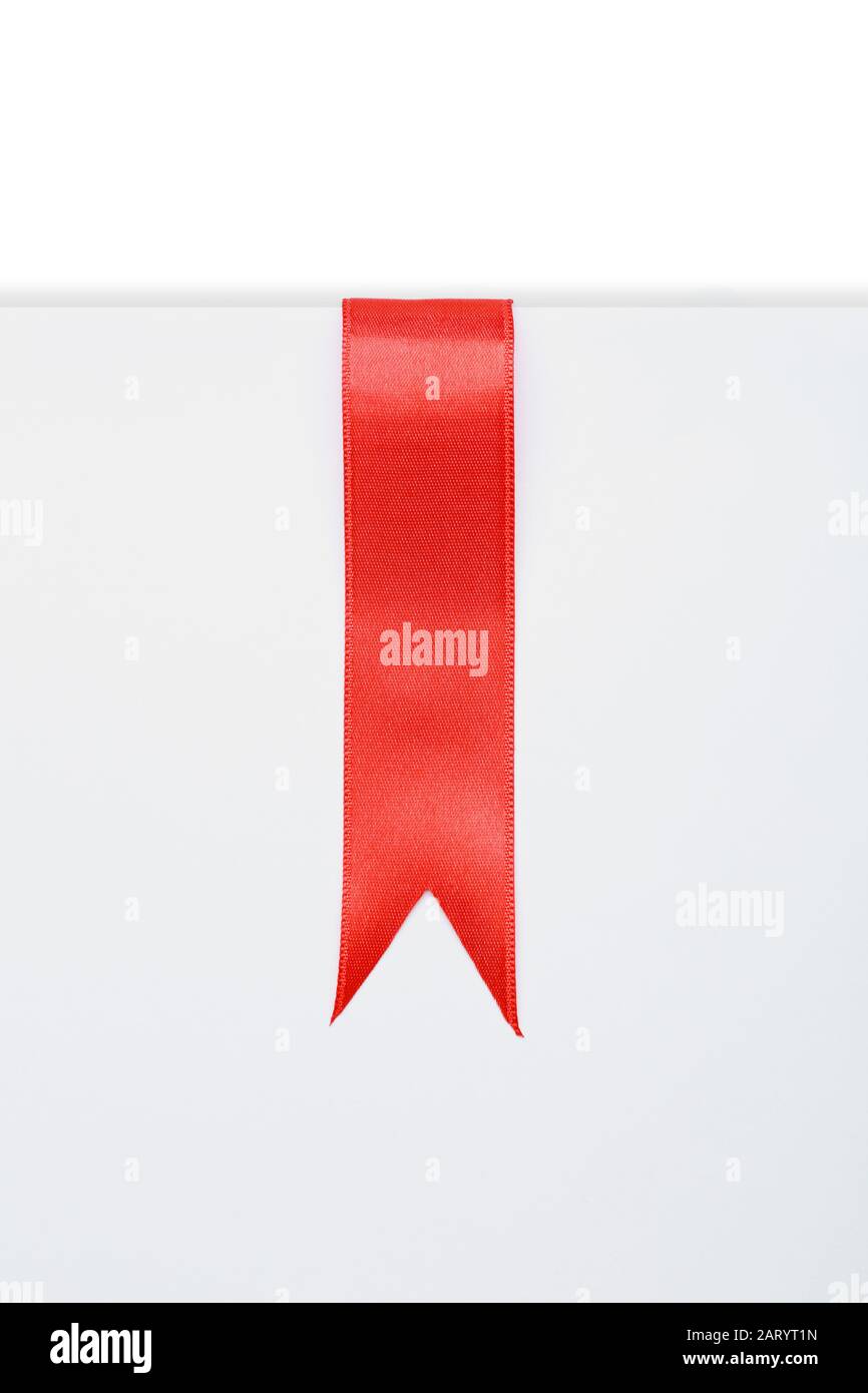 Paper sheet with beautiful red ribbon on white background Stock Photo ...