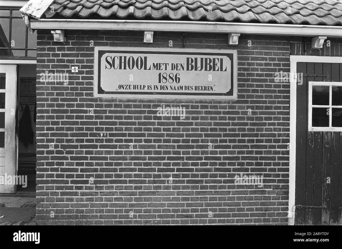 Staphorst  Outbreak polio in Staphorst.. School with the Bible from 1886, with the text: Our help is in den name des Heeren Date: March 15, 1971 Location: Overijssel, Staphorst Keywords: christian education, village images, schools Stock Photo