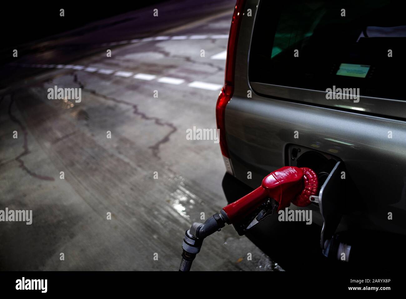 Fuel nozzle in car Stock Photo