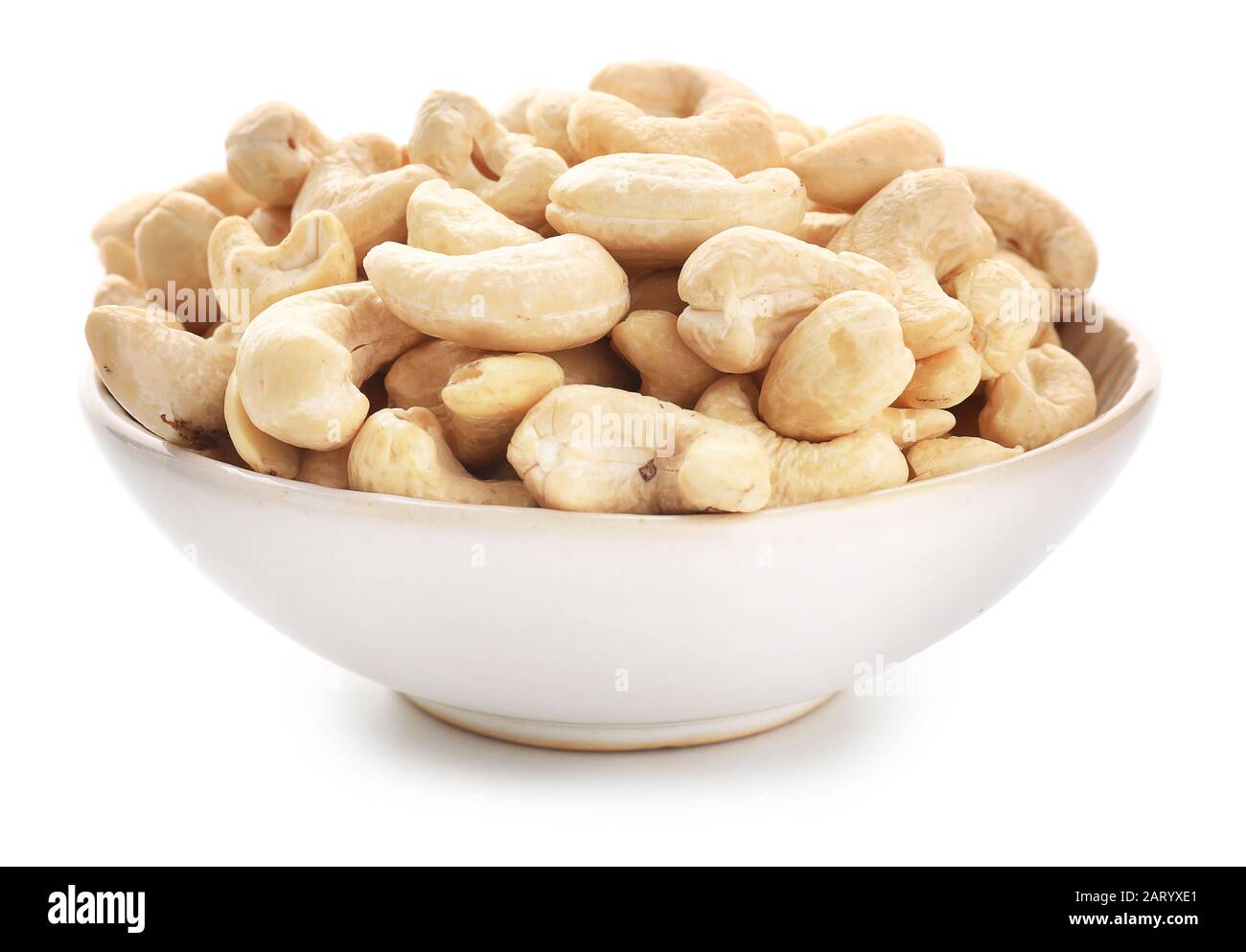 Bowl with cashew nuts on white background Stock Photo Alamy