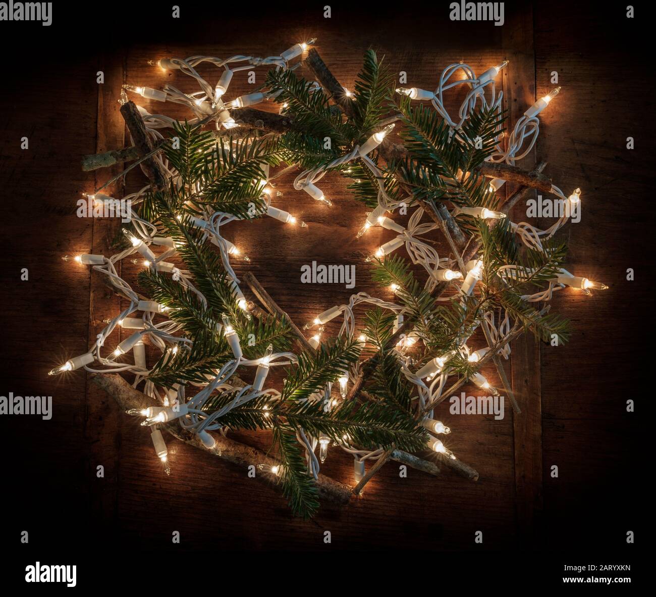 Wreath made from pine fronds, sticks and fairy lights Stock Photo Alamy