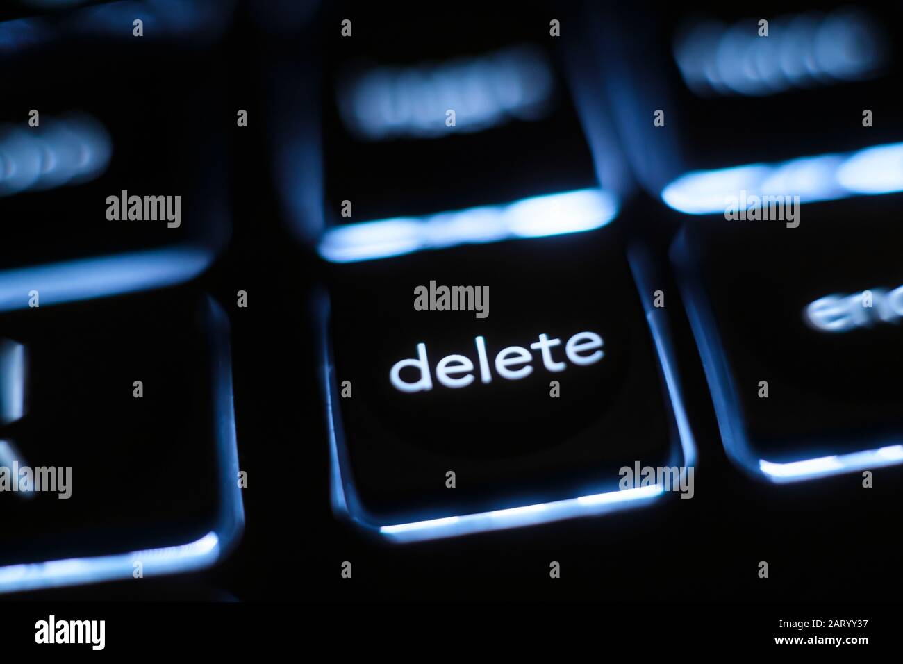 Illuminated 'delete' key on keyboard Stock Photo