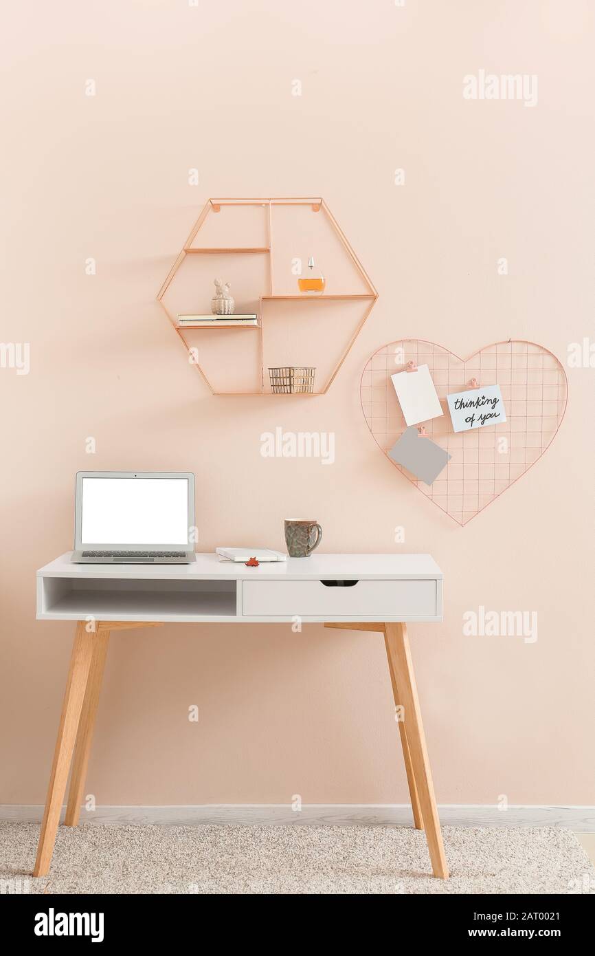 Modern comfortable workplace near color wall Stock Photo