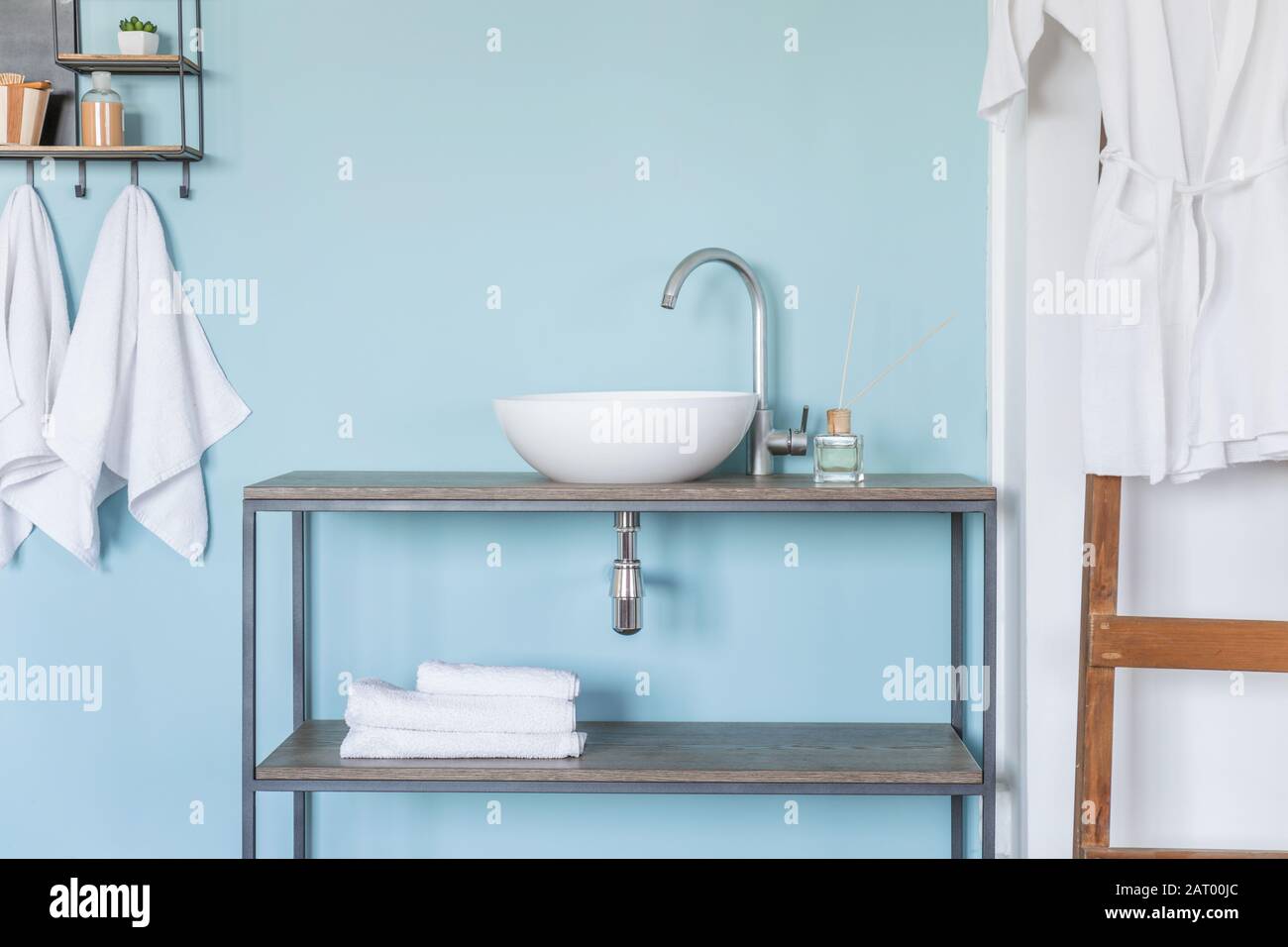 Interior of clean bathroom with sink near color wall Stock Photo - Alamy
