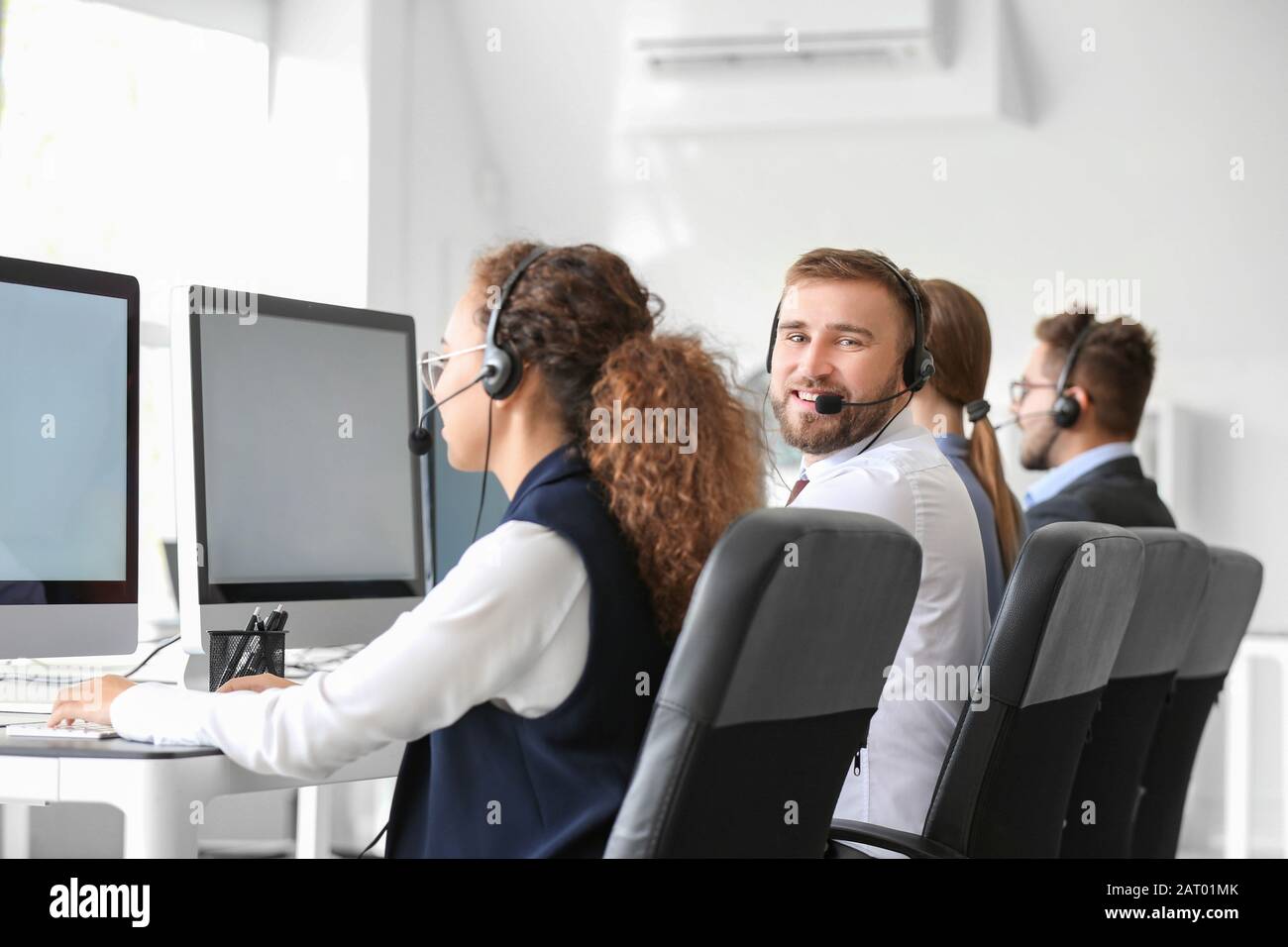Technical support agents working in office Stock Photo