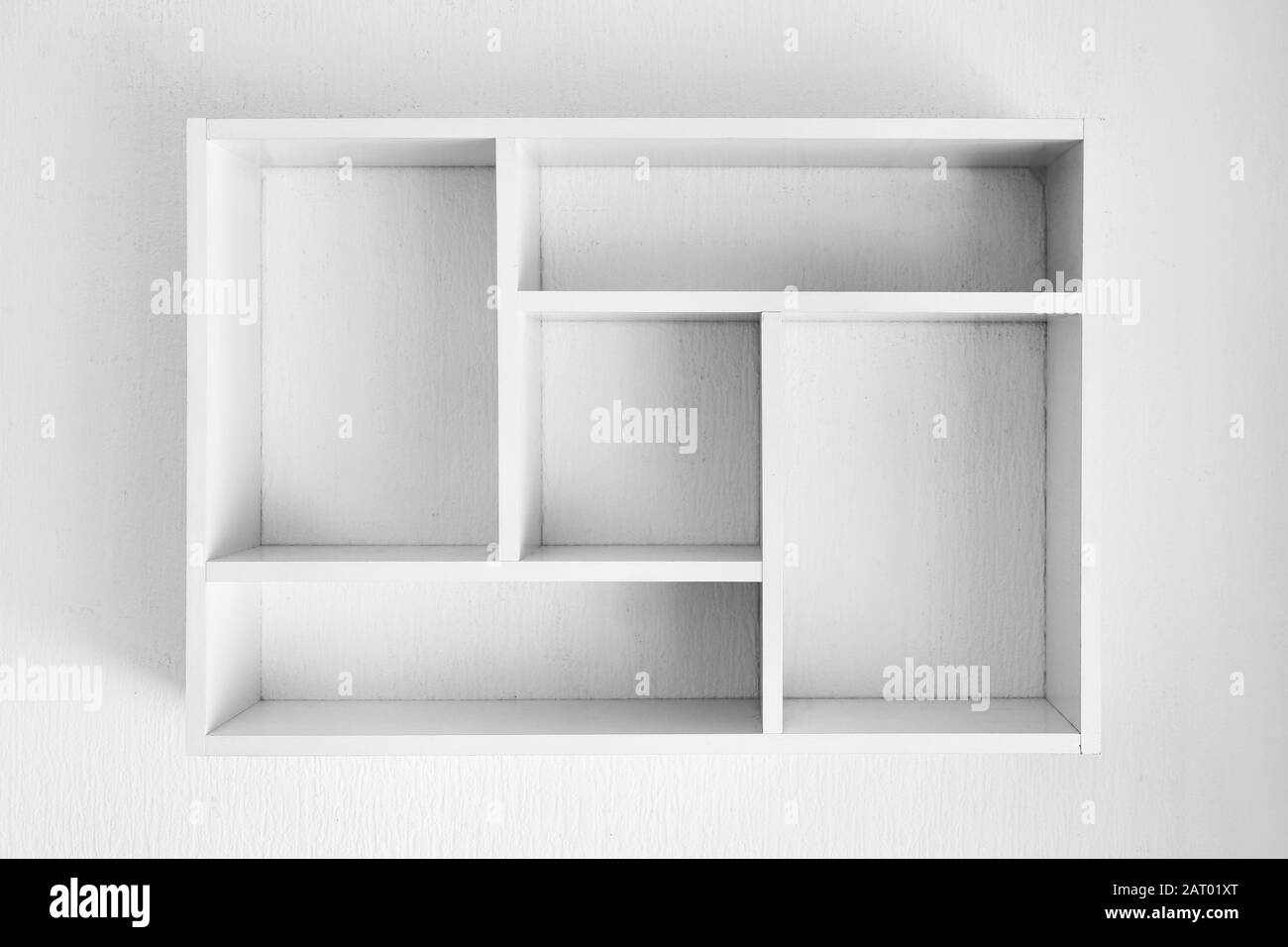 Empty shelf hanging on white wall Stock Photo Alamy