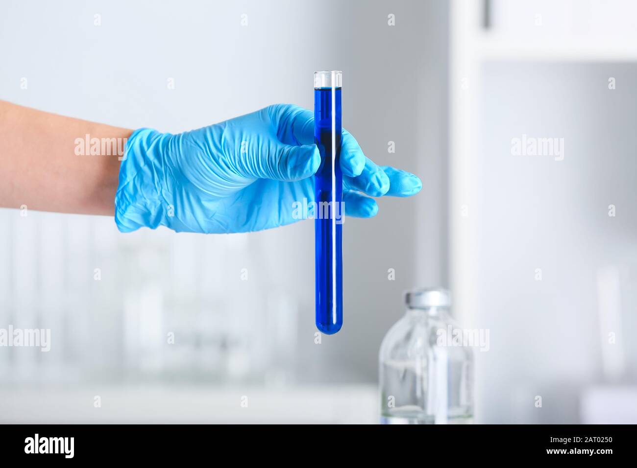 Hand of scientist holding test tube with sample in laboratory Stock ...