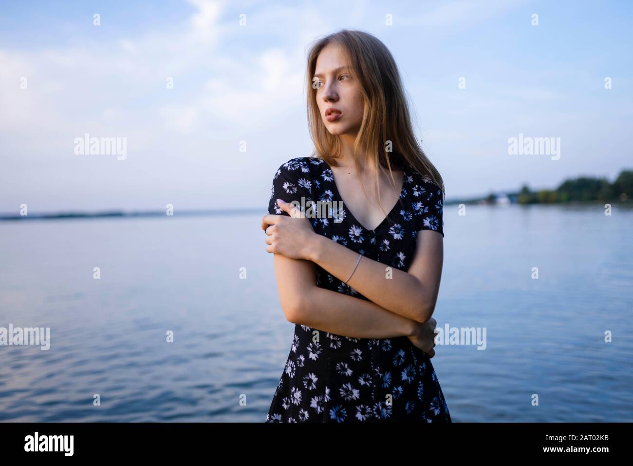 Woman wearing black dress hi-res stock photography and images - Alamy
