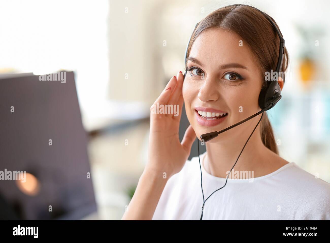 Female technical support agent working in office Stock Photo - Alamy