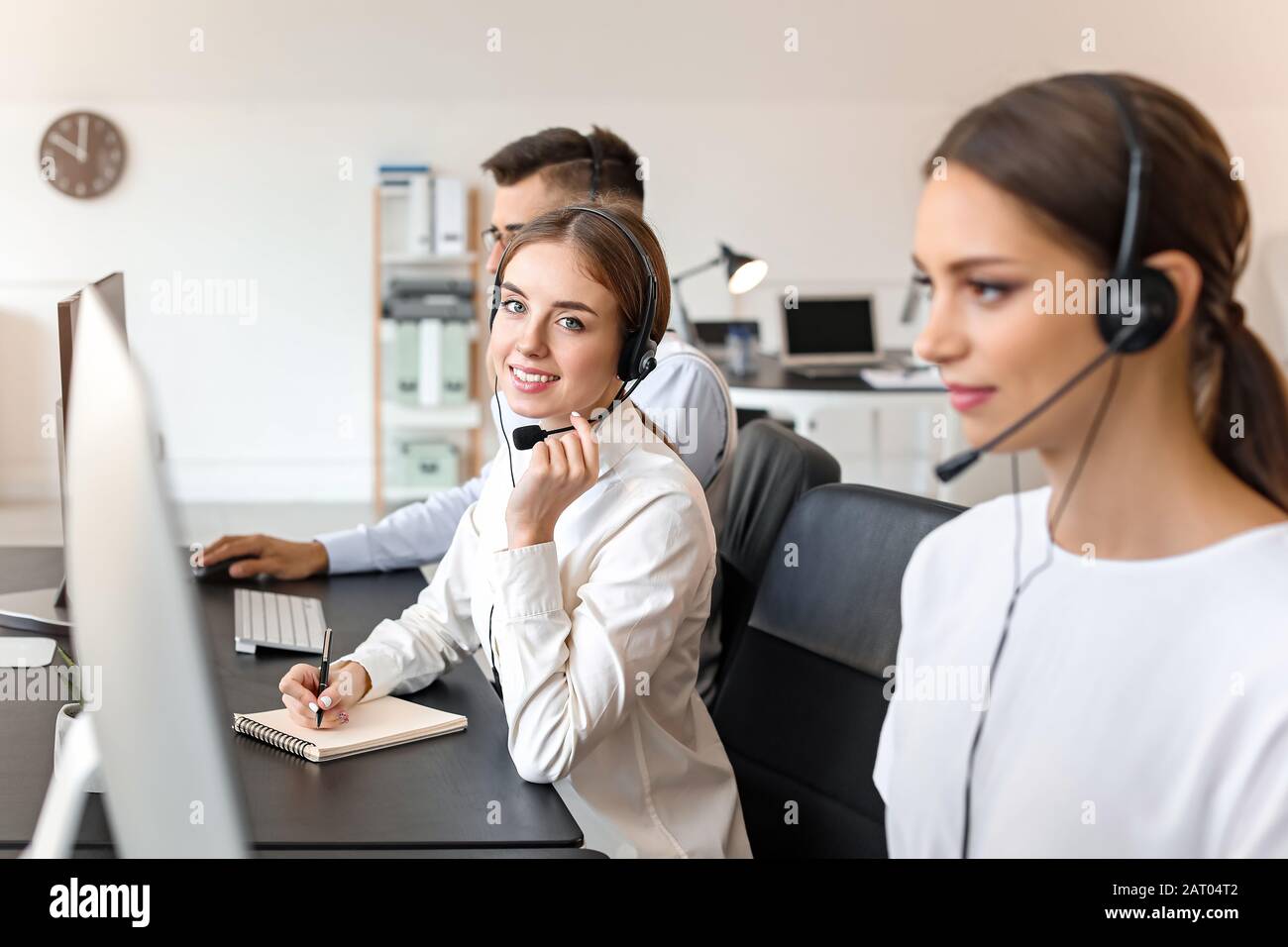 Team of technical support agents working in office Stock Photo