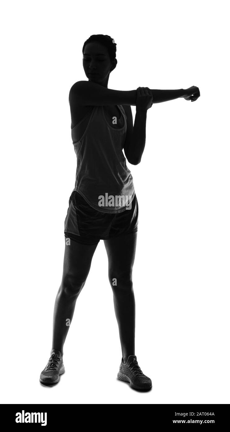 Silhouette of sporty young woman on white background Stock Photo
