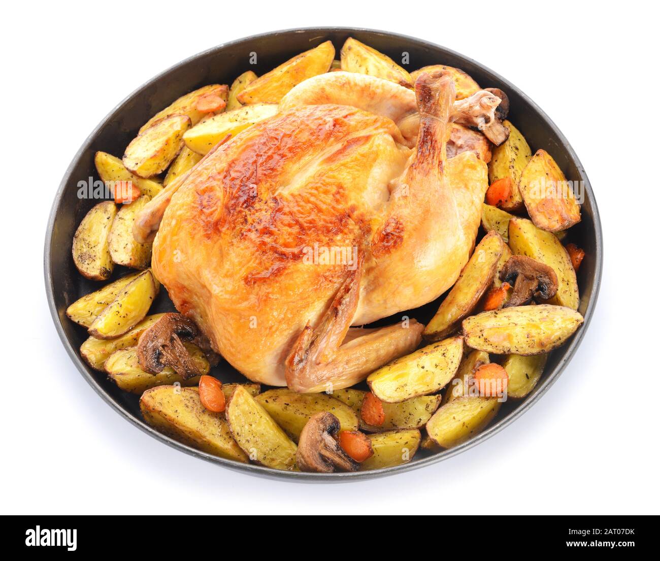 Dish with baked chicken and potato on white background Stock Photo - Alamy