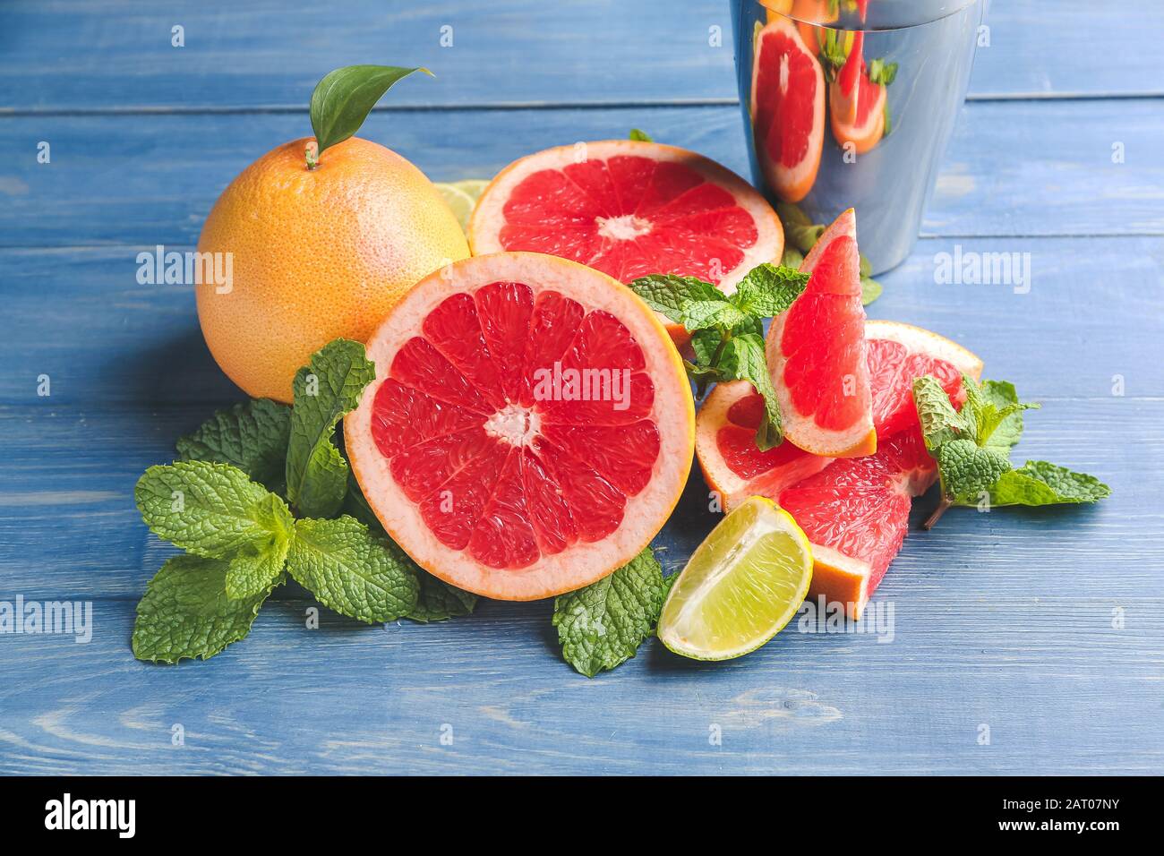 Fresh grapefruits and lime on table Stock Photo