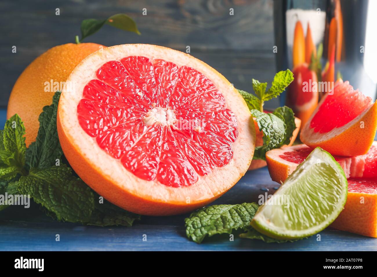 Fresh grapefruits and lime on table Stock Photo