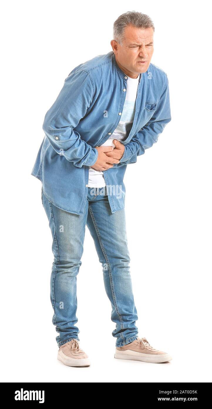 Mature man suffering from abdominal pain on white background Stock ...
