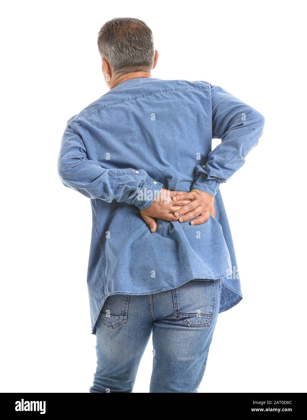 Mature man suffering from back pain on white background Stock Photo - Alamy