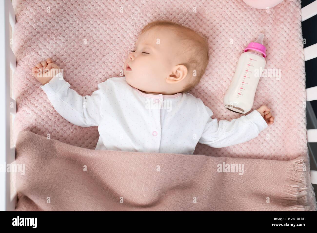 Sleeping Baby With Bottle Of Milk In Crib Stock Photo 341760007