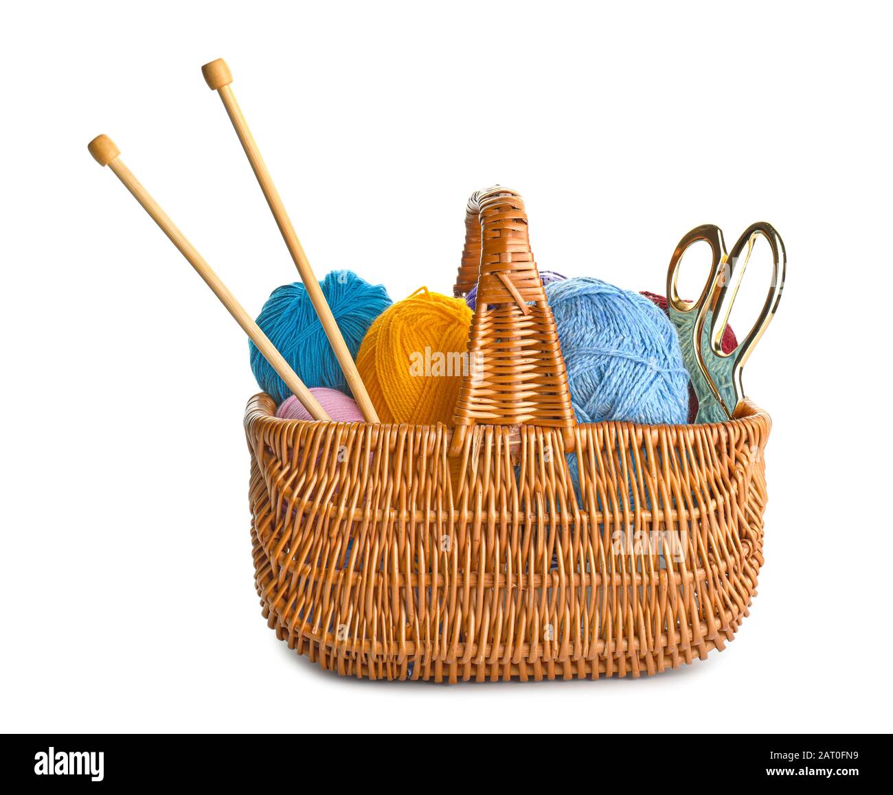Basket with knitting yarns and needles on white background Stock Photo ...