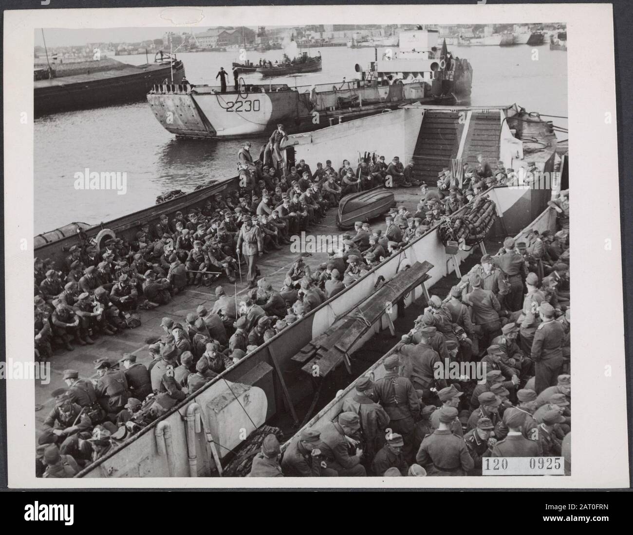 German prisoners of war with landing boats from Den Helder to Germany Date: June 1945 Location: Den Helder Keywords: prisoners of war, ships, World War II Stock Photo