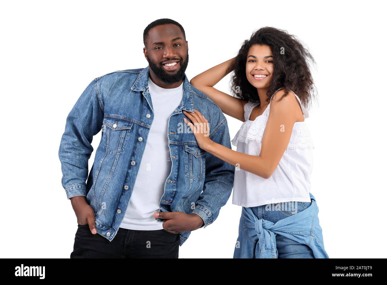 Portrait of stylish young African-American couple on white background ...
