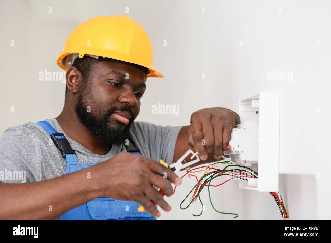 African American electrician performing wiring in room Stock Photo Alamy African American electrician performing wiring in room Stock Photo Alamy