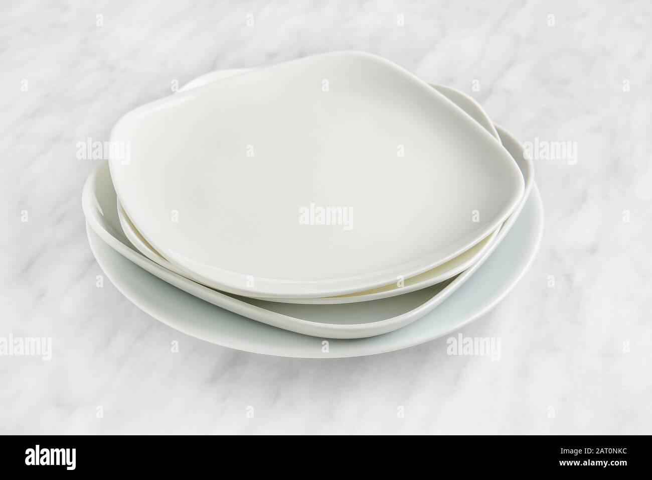 Stack of plates on light background Stock Photo