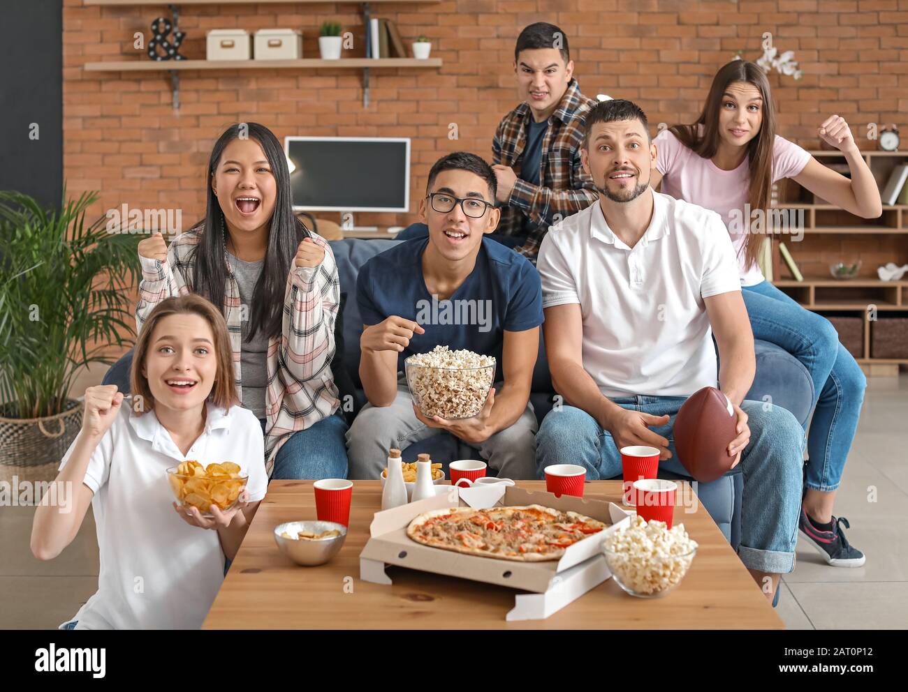 Group of fans watching rugby on TV Stock Photo Alamy
