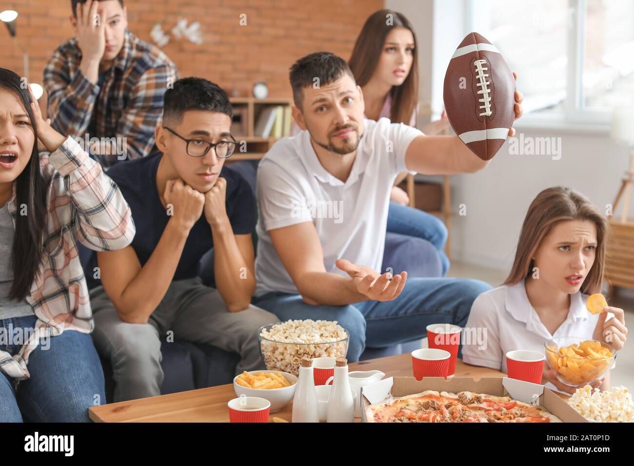 Group of fans watching rugby on TV Stock Photo Alamy