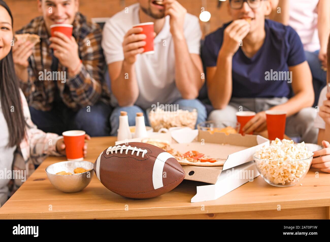 Group of fans watching rugby on TV Stock Photo Alamy