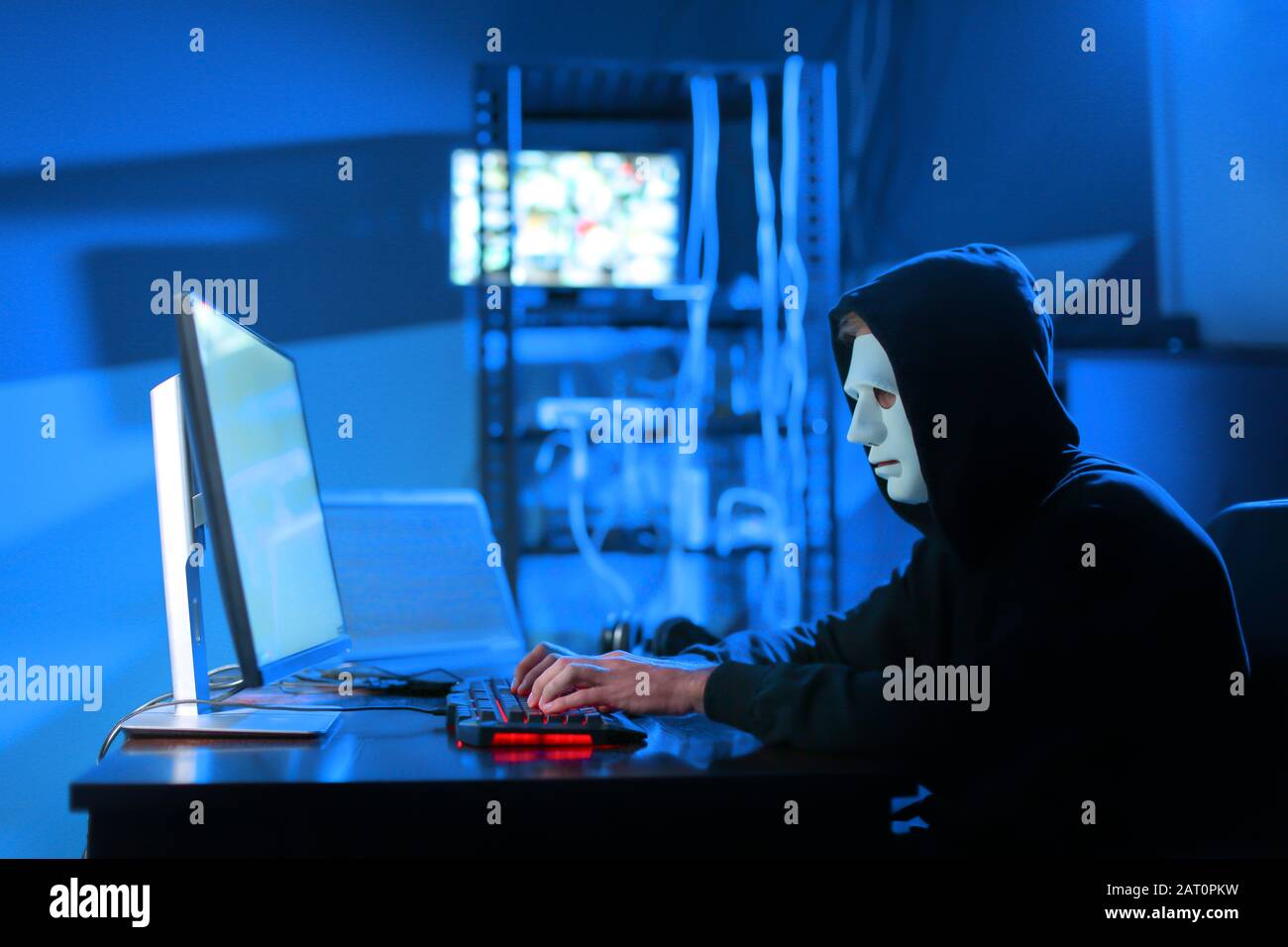 Professional hacker using computer in dark room Stock Photo - Alamy