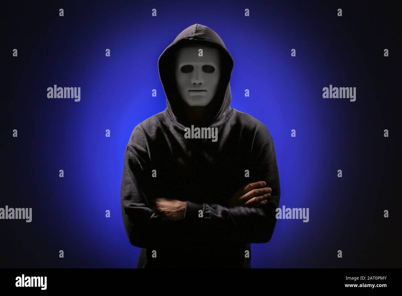 Professional hacker in mask on dark background Stock Photo