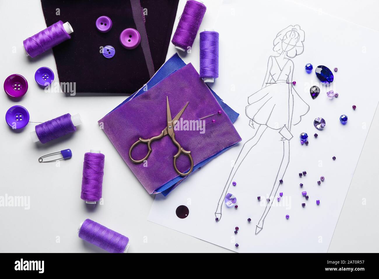 Set of tailor's supplies with sketch on white background Stock Photo