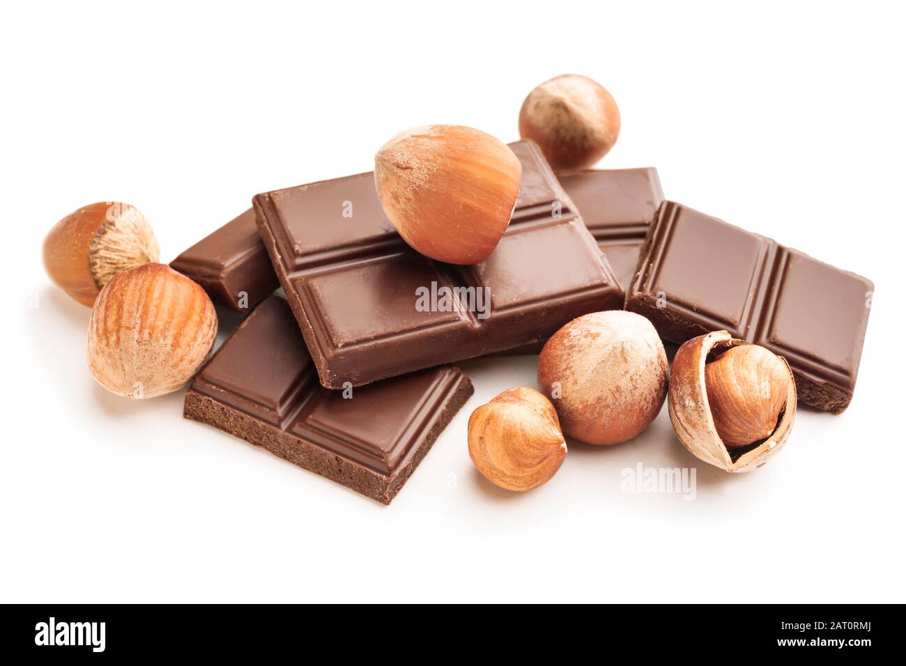 Tasty chocolate with hazelnuts on white background Stock Photo