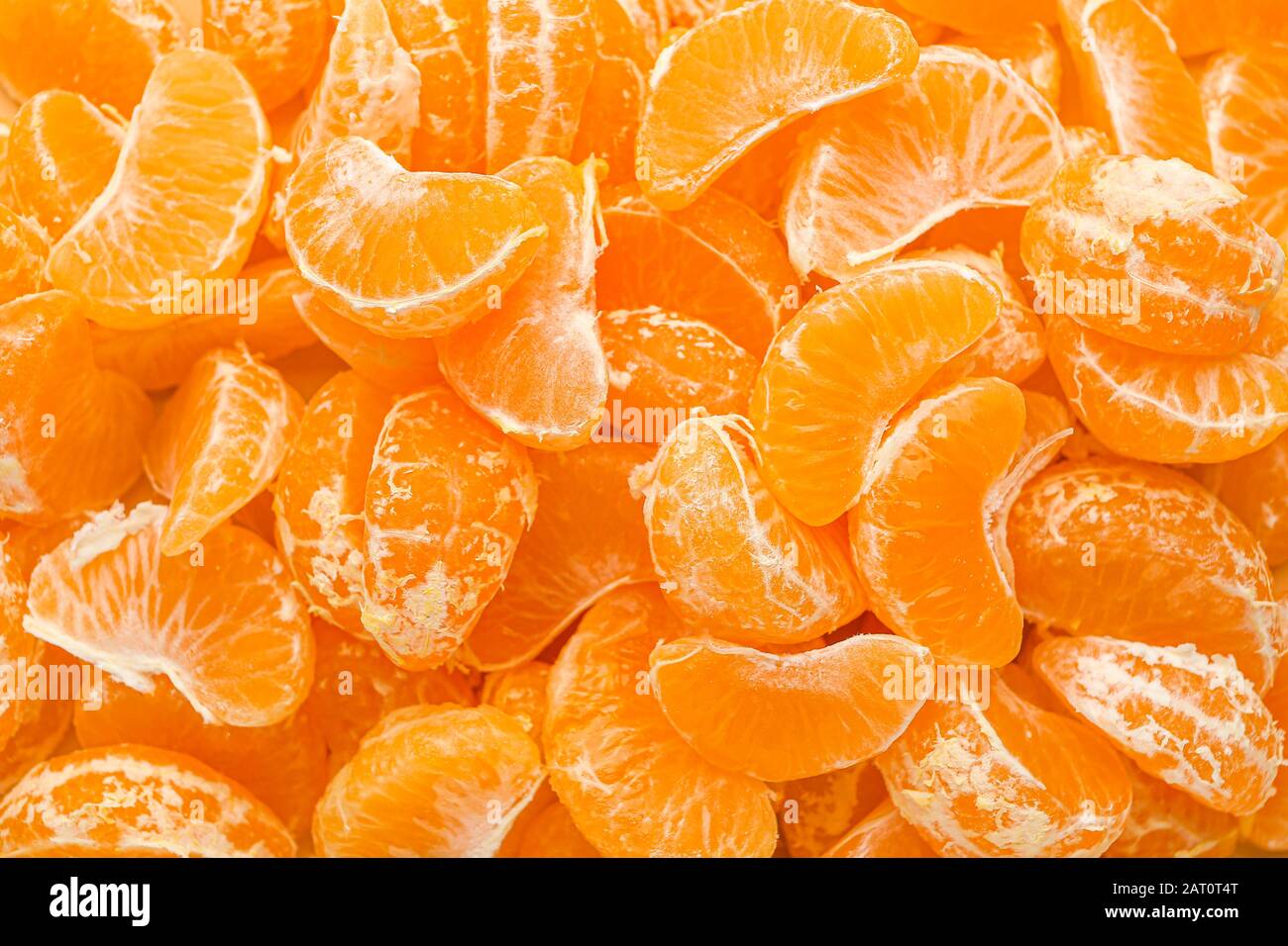 Many tangerine segments as background Stock Photo Alamy