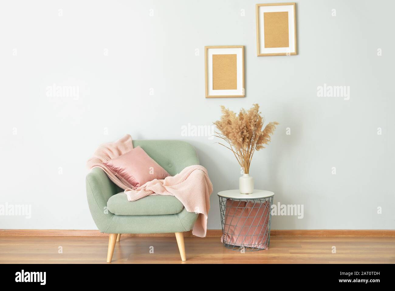 Interior of light modern room with table and armchair Stock Photo - Alamy