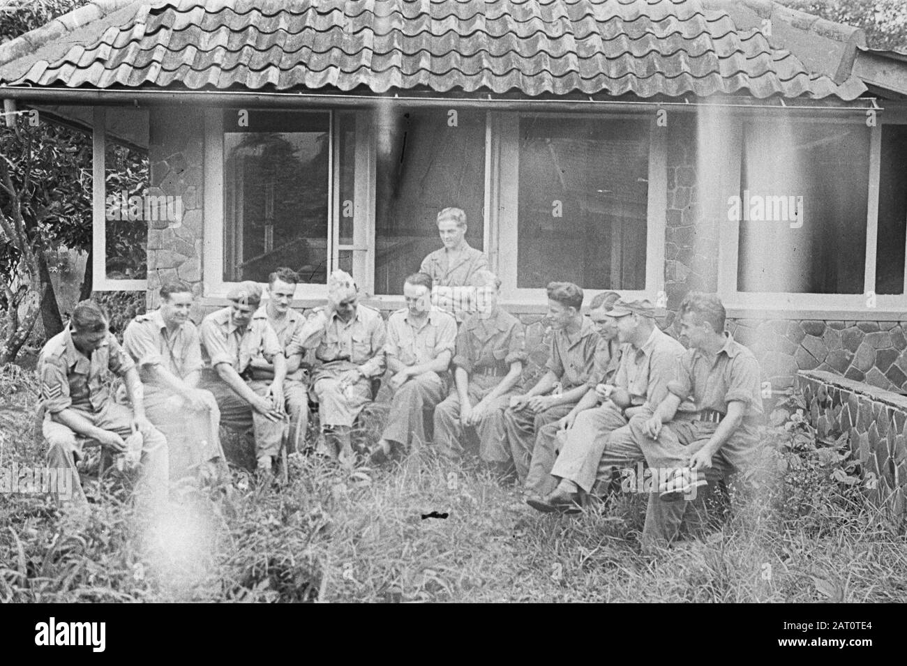 Photo report near Buitenzorg  A divine service [?]. Defence of military personnel for building Date: January 1947 Location: Bogor, Indonesia, Java, Dutch East Indies Stock Photo