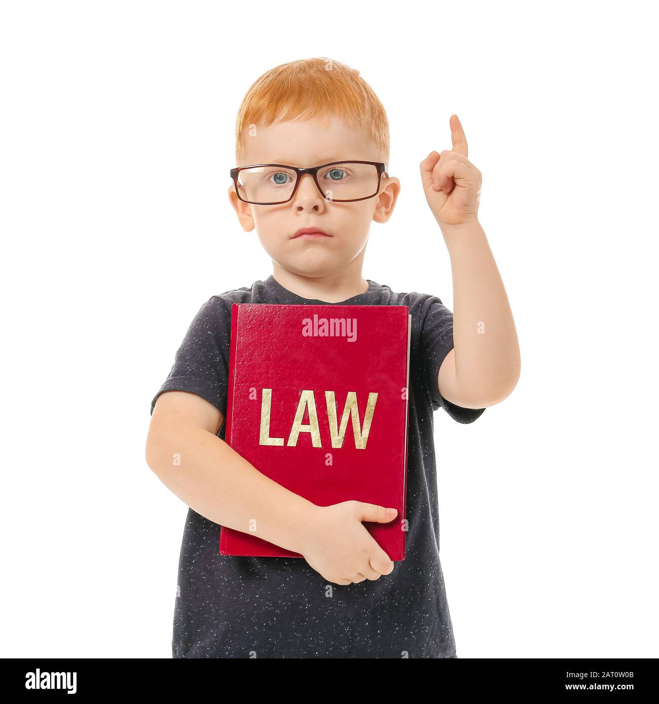 Cute little boy with law book and raised index finger on white