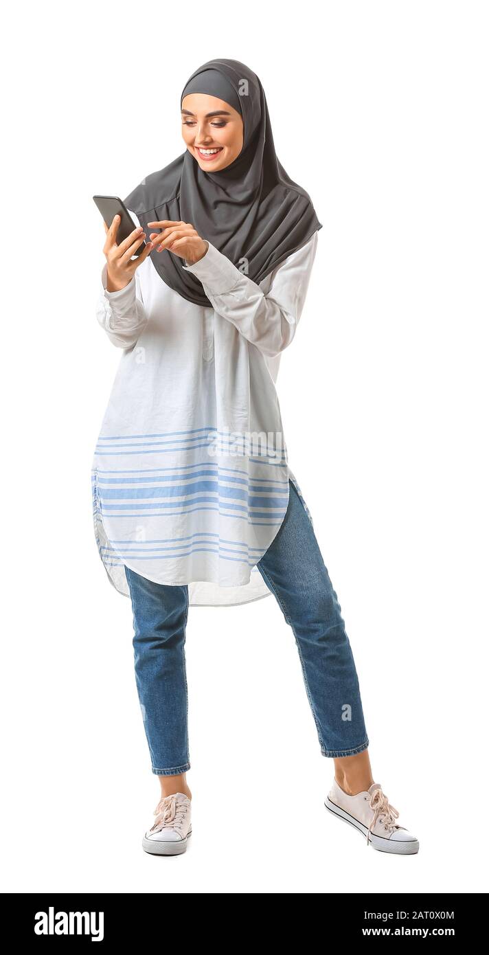 Beautiful Arab woman with mobile phone on white background Stock Photo ...