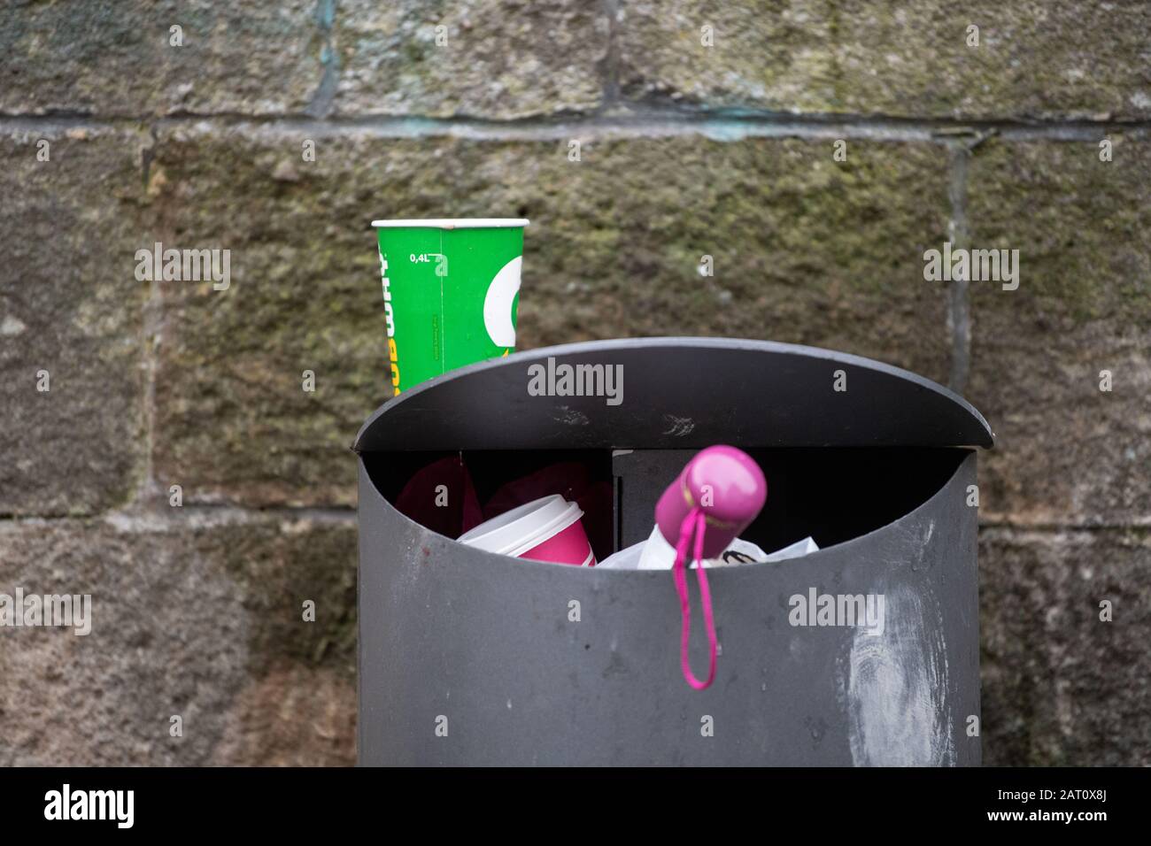 28 January 2020, Tübingen: A paper cup stands on a trash can near the ...