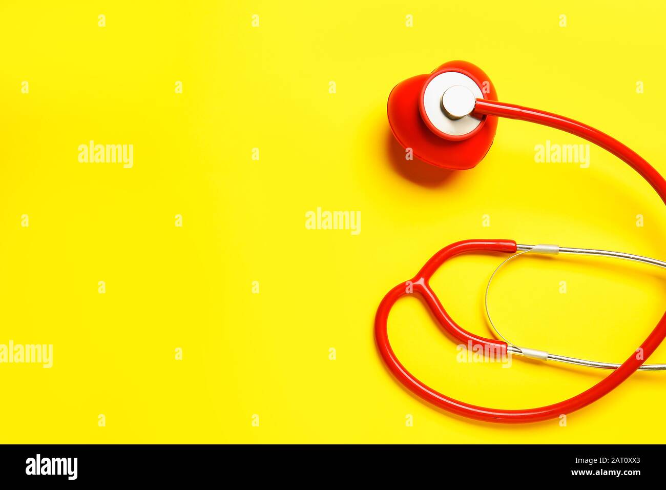 Modern stethoscope and heart on color background Stock Photo - Alamy