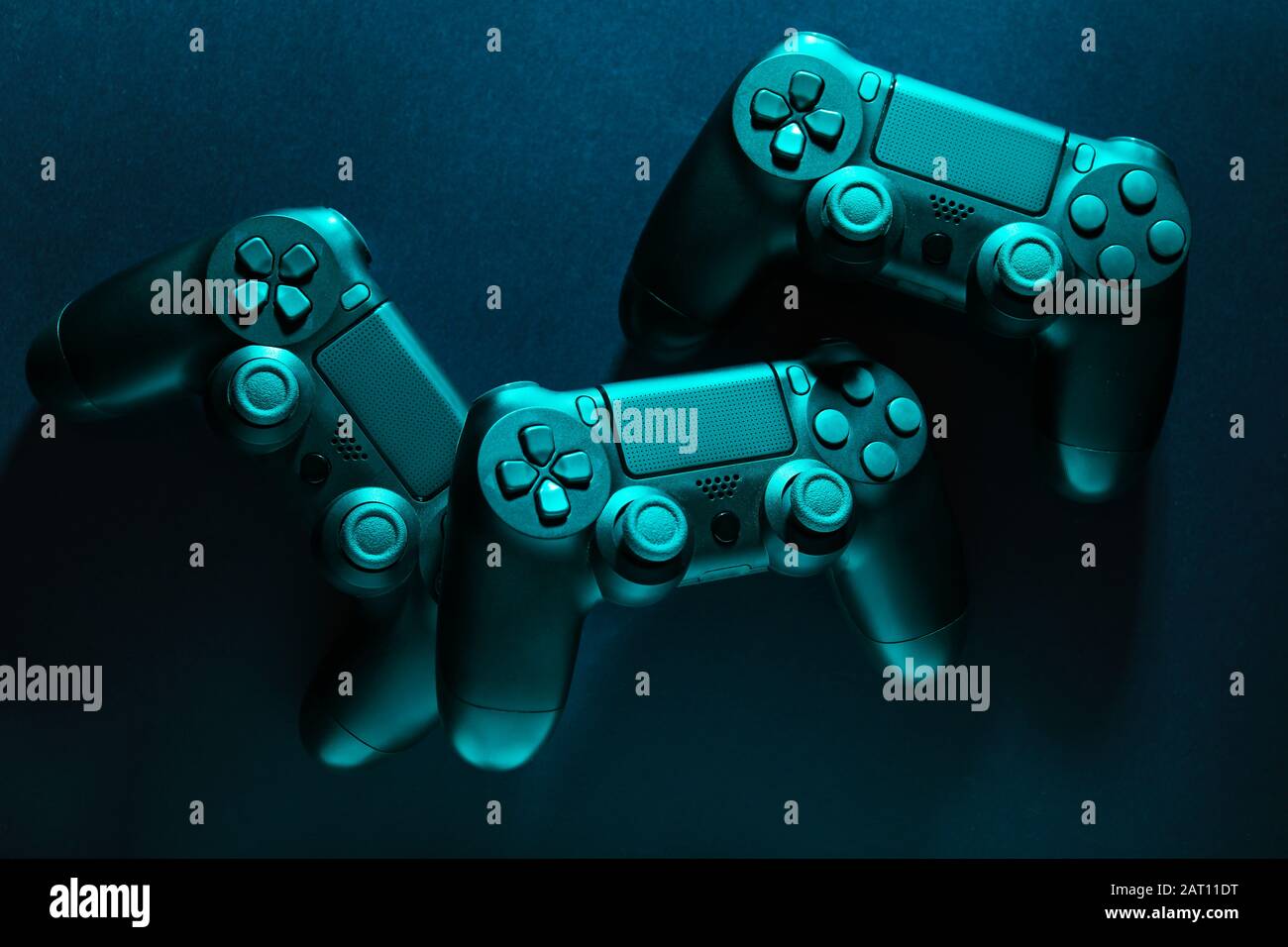 Modern game pads on dark background Stock Photo - Alamy