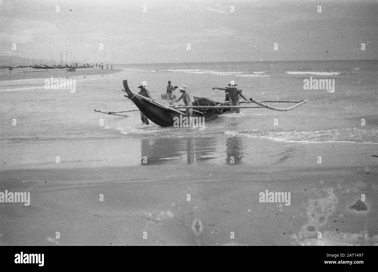 Fishing in the surf Black and White Stock Photos & Images - Alamy