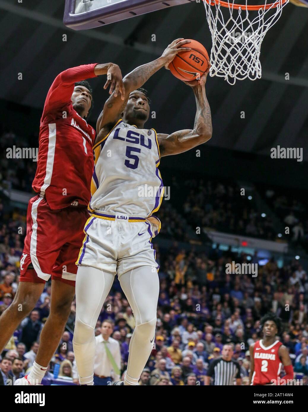 Baton Rouge, LA, USA. 29th Jan, 2020. LSU's Emmitt Williams (5) goes for a dunk past Alabama's Herbert Jones (1) during NCAA Basketball action between the Alabama Crimson Tide and the LSU Tigers at the Pete Maravich Assembly Center in Baton Rouge, LA. Jonathan Mailhes/CSM/Alamy Live News Stock Photo