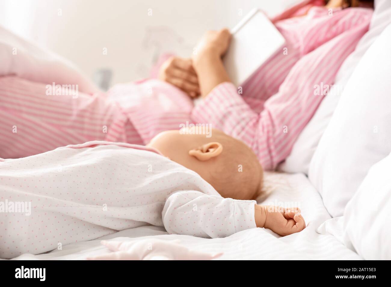 Cute baby sleeping in bed Stock Photo - Alamy