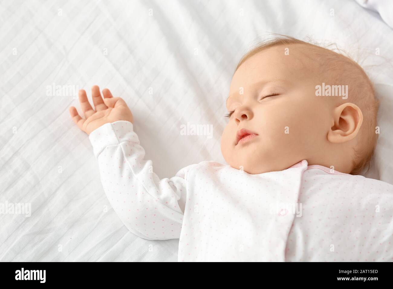 Cute baby sleeping in bed Stock Photo Alamy
