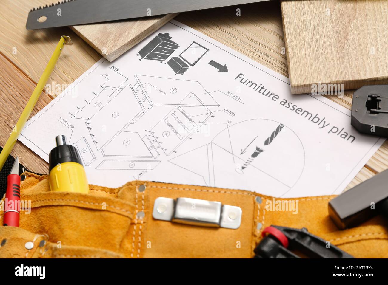 Furniture assembling plan with set of tools on table Stock Photo