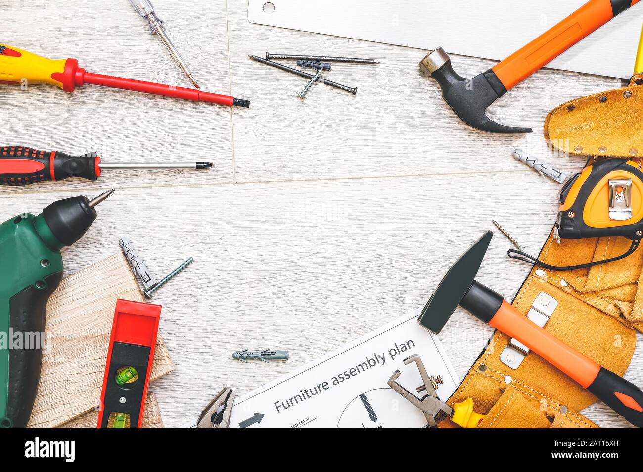 Furniture assembling plan with set of tools on table Stock Photo