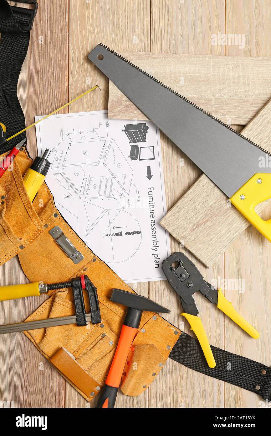 Furniture assembling plan with set of tools on table Stock Photo