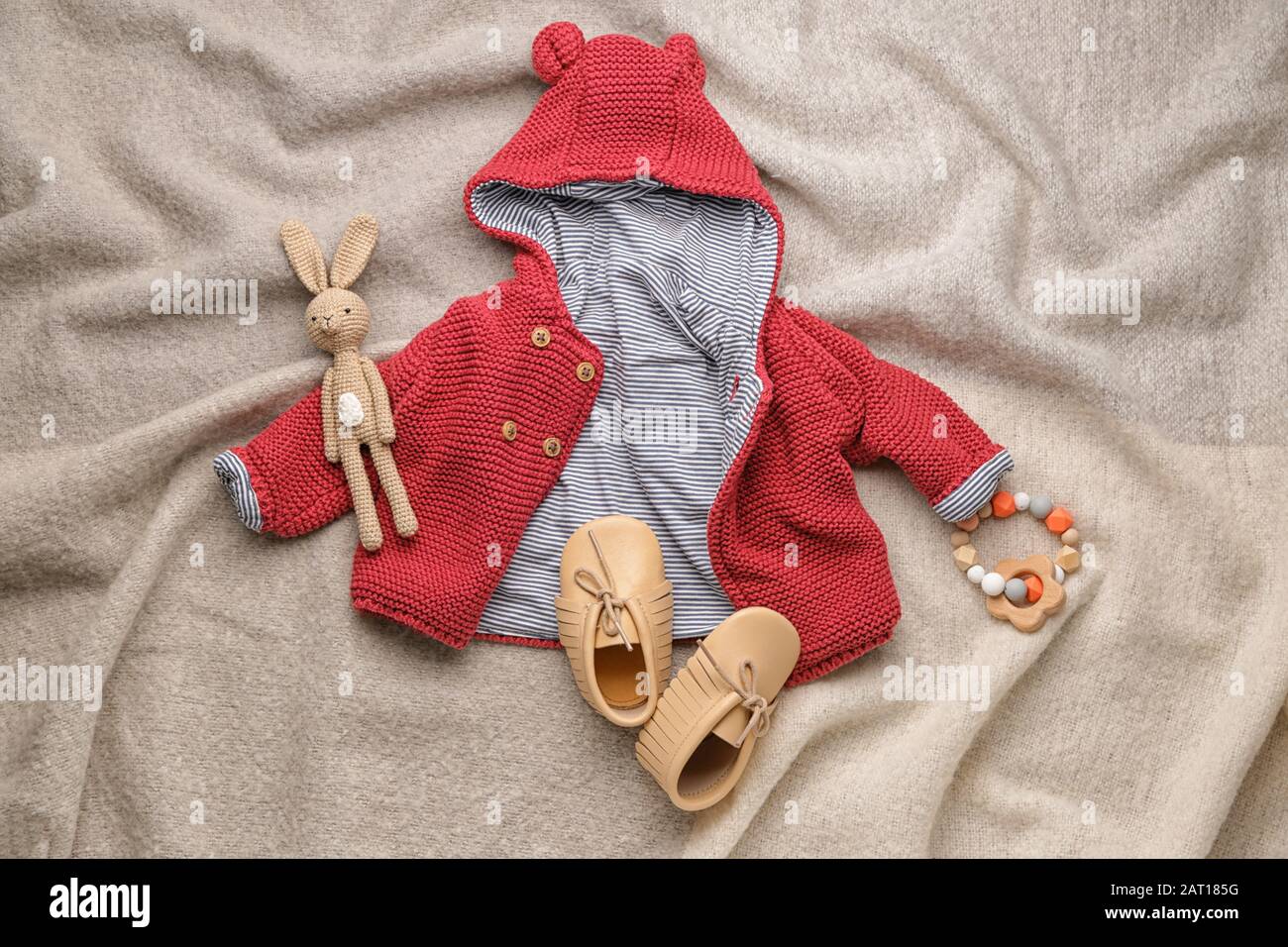 Baby clothes and accessories on plaid Stock Photo Alamy
