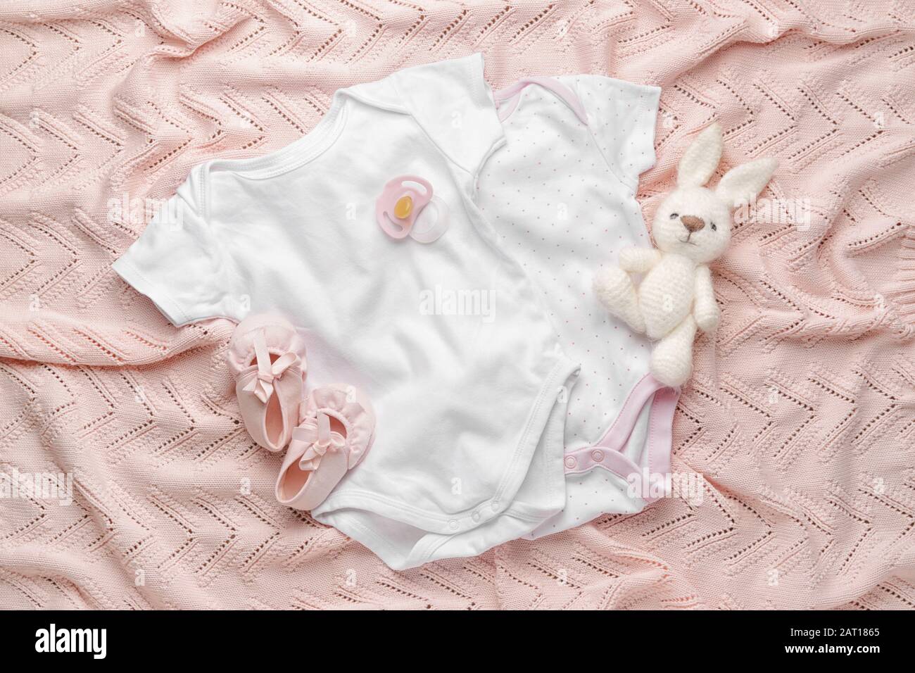 Baby clothes and accessories on plaid Stock Photo Alamy